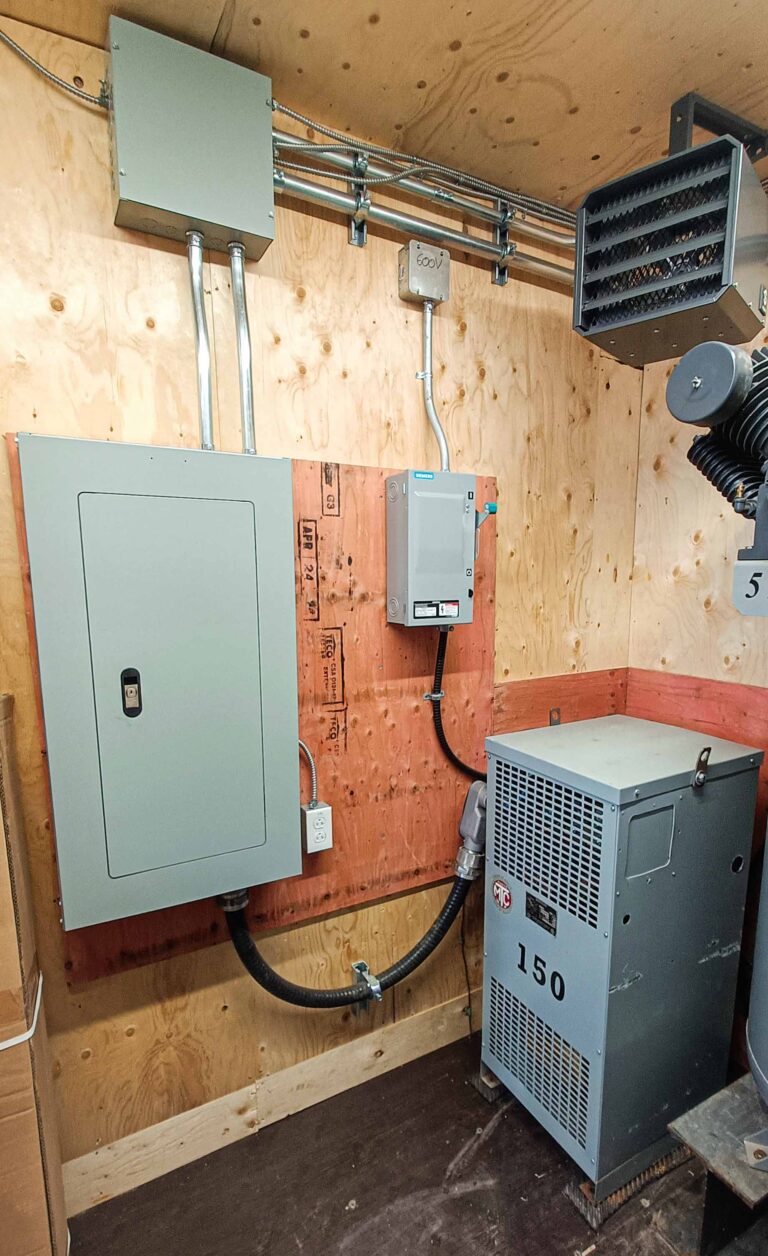 Shipping container electrical installation. Panel and 600V transformer 120V/208V